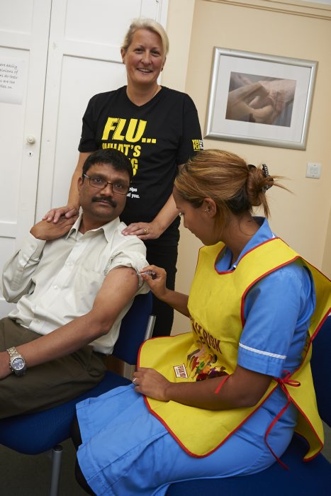 Associate Medical Director Dr Raghuraman receives his flu jab